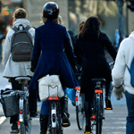 pedestrians riding bicycles