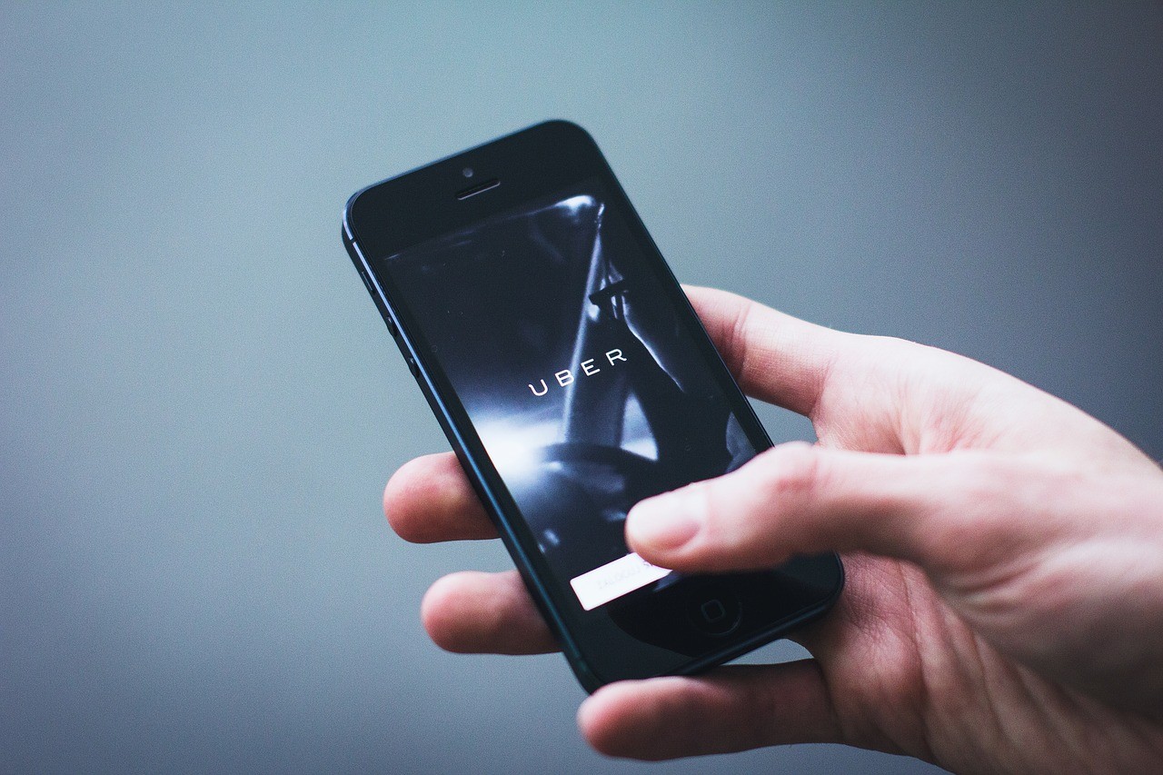 man ordering an Uber rideshare